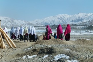 Women and children on their way to a winter-time wedding in Bamyan