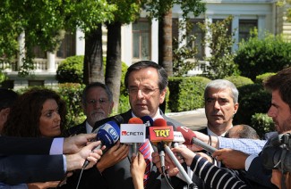 Samaras with media